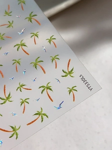 Close-up of laser iridescent palm tree and bird nail art stickers with YT5330LS model code