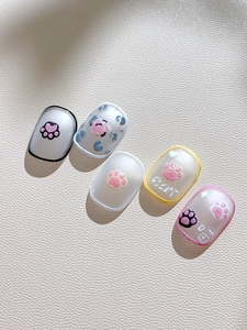 Close-up of 3D cat paw nail stickers with embossed resin textures and creative art designs