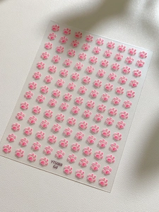 Macro shot of 3D pink cat paw nail art stickers with embossed texture on YT5088 sheet