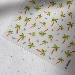 Tropical laser coconut tree nail stickers with iridescent bird patterns on a clear sheet