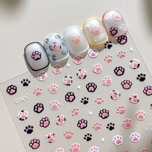 3D embossed cat paw nail art stickers with pink and black raised patterns for DIY manicure