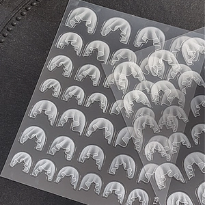 3D embossed white lace nail stickers with wedding dress pattern on dark background