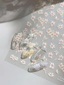 Floral nail art stickers with iridescent pink 3D flower and butterfly patterns