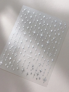 Macro d'autocollants pour ongles étoiles argentées YT5185 sur surface en cuir doux