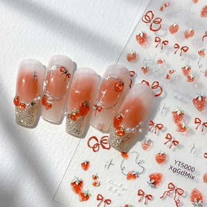 3D strawberry and red bow nail art stickers on pink gradient base with glitter detail