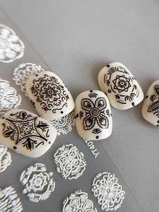 Macro detail of YT407 black mandala and geometric flower embossed nail art stickers