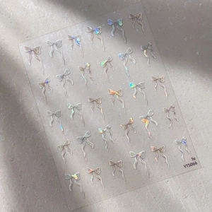Autocollants holographiques pour ongles avec nœuds en ruban et finition brillante irisée