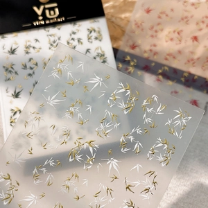Bamboo nail art stickers with embossed texture in gold, green, and white colors