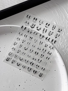Macro detail of retro cartoon facial expression nail stickers with PM YT3883 model code