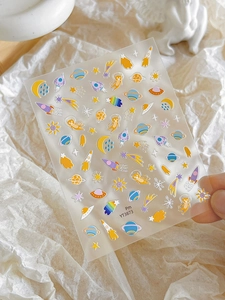 Detail of YT3873 nail art stickers featuring cartoon astronauts and colorful planets