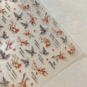 Detail of Chinese plum blossom and butterfly nail art stickers with gold foil stamping
