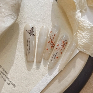 Detail of Chinese plum and butterfly nail art stickers on long trapezoid false nails