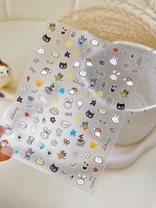 Close-up of cute cartoon nail stickers featuring rabbits, bows and floral motifs YT3914