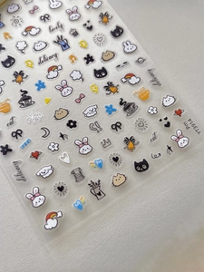 Macro detail of YT3914 nail art stickers featuring cute cartoon bunnies and bows