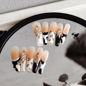 Floral handmade press-on nails with 3D embossed flowers and leopard patterns in long ballerina