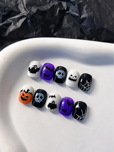 Detailed set of 10 Halloween press-on nails with pumpkin, skull, and bat designs