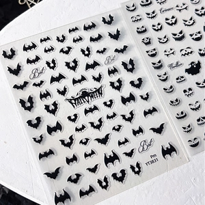 Halloween nail stickers with black bat motifs and spooky expressions on model YT3831