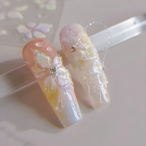 3D white floral almond nail stickers with pearlescent finish and jelly water drop effects