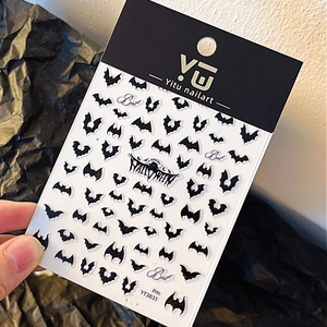 3D Halloween bat nail stickers with embossed black patterns on elegant retail packaging