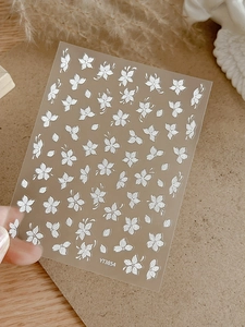 Macro detail of white floral embossed nail art stickers model YT3854 with petal patterns