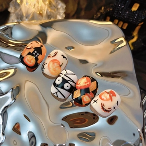 Halloween pumpkin and ghost press-on nails set with orange mummy and castle patterns