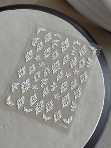Detail of 5D embossed white and silver flower nail stickers YT3866b on transparent sheet