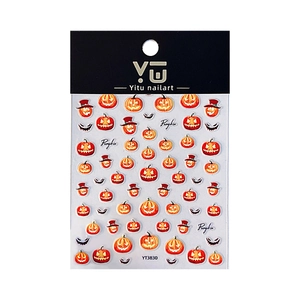 Halloween pumpkin nail art stickers with spooky faces and festive designs for manicures