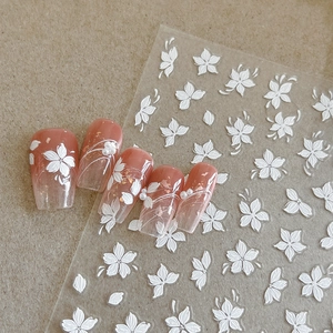 3D embossed white flower nail art stickers with elegant floral patterns for manicure