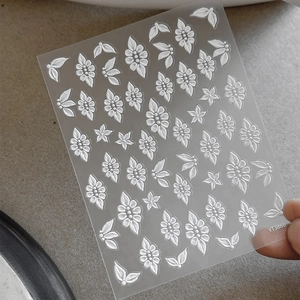 5D embossed white flower nail stickers with floral petals and leaf patterns for DIY manicure