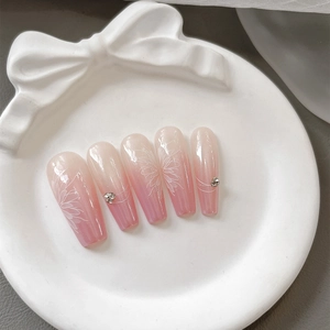 Pink gradient long trapezoid press-on nails with white floral art and rhinestones