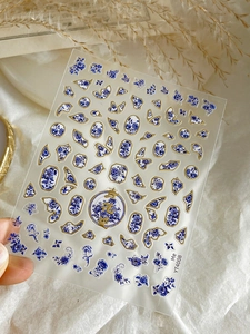 Detail of YT4008 blue and white porcelain nail stickers with elegant gold foil accents