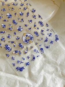 Detail of blue and white floral nail stickers with gold foil accents, model YT4008