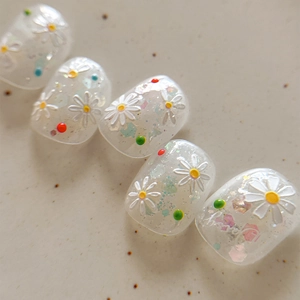 3D embossed daisy press-on nails with colorful dots and holographic glitter accents