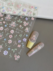 3D relief nail art stickers featuring pink floral patterns and bow designs on long nails