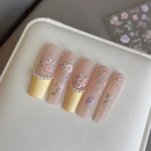 3D floral embossed press-on nails with pink flowers and pearls in matte finish