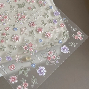 3D embossed floral nail art stickers with pink and purple flower designs and green leaves