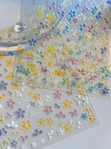 Macro detail of 3D jelly five-petal flower nail stickers with colorful relief textures