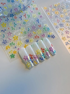 Close-up of YT3909 3D jelly flower nail stickers with colorful petal textures and application