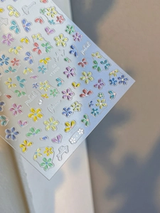 Macro view of 5D embossed colorful five-petal flower nail stickers with jelly texture