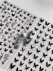 Detail of Chinese ink style butterfly and bamboo nail art stickers with sample display