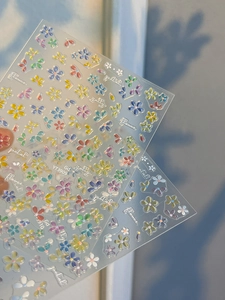 Detailed view of colorful 3D jelly flower nail stickers with floral patterns and adhesive backing