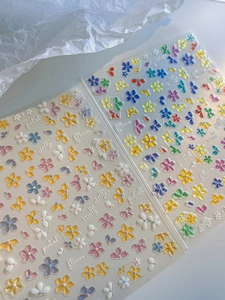 Macro detail of 3D jelly flower nail art stickers with colorful five-petal petal patterns