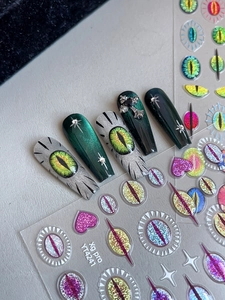 Detail of YT4241 cat eye press-on nails with 3D monster eye and star patterns