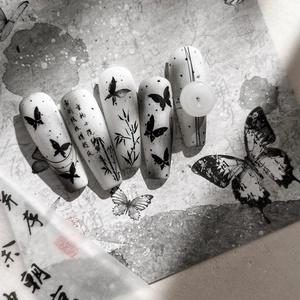 Ink style butterfly nail art stickers with bamboo patterns and vintage aesthetic