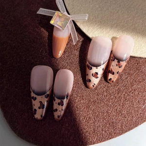 Almond leopard print French fake nails with 3D bow and sparkling iridescent gemstone