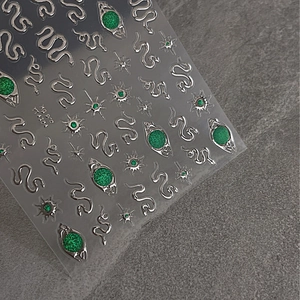 Embossed emerald green snake and silver star nail stickers with luxury gold foil accents