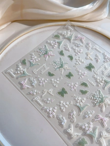 Detail of 3D embossed lily of the valley and butterfly nail art stickers with YT4111 code