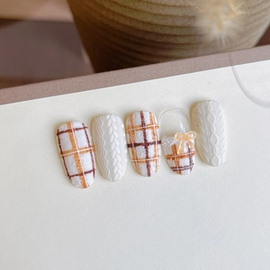 Plaid textured 3D embossed knit nail art stickers in cream white and amber bow design