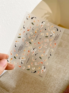 Detail of 3D koi fish nail art stickers with traditional Chinese calligraphy on YT4156