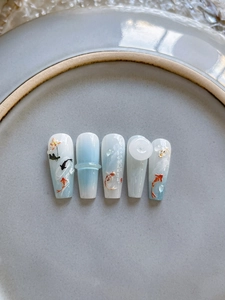Detailed 3D relief nail art with koi carp and lotus hand-painted Chinese patterns